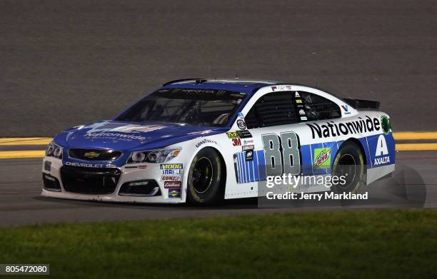 Dale Earnhardt Jr., driver of the Nationwide Chevrolet, drives to the garage area after being involved in an on-track incident during the Monster...