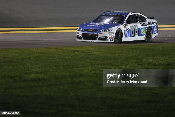 Dale Earnhardt Jr., driver of the Nationwide Chevrolet, drives to the garage area after being involved in an on-track incident during the Monster...