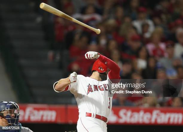 Danny Espinosa of the Los Angeles Angels of Anaheim loses his bat as he swings and misses in the seventh inning against the Seattle Mariners at Angel...
