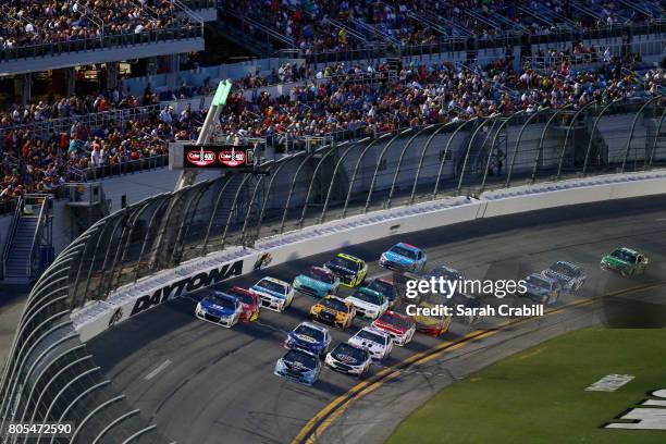 Brad Keselowski, driver of the Detroit Genuine Parts Ford, leads a pack of cars during the Monster Energy NASCAR Cup Series 59th Annual Coke Zero 400...