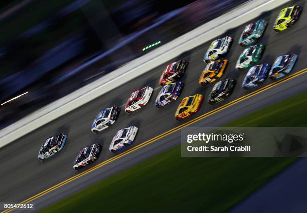 Brad Keselowski, driver of the Detroit Genuine Parts Ford, leads a pack of cars during the Monster Energy NASCAR Cup Series 59th Annual Coke Zero 400...