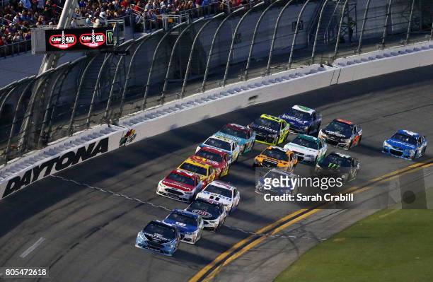 Brad Keselowski, driver of the Detroit Genuine Parts Ford, leads a pack of cars during the Monster Energy NASCAR Cup Series 59th Annual Coke Zero 400...