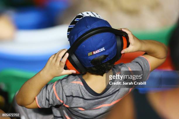 Young race fan looks on during the Monster Energy NASCAR Cup Series 59th Annual Coke Zero 400 Powered By Coca-Cola at Daytona International Speedway...
