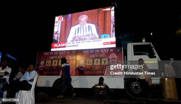 Selective gathering watching the live telecast of GST launching in the midnight hours at Albert Ekka Chowk on June 30, 2017 in Ranchi, India.