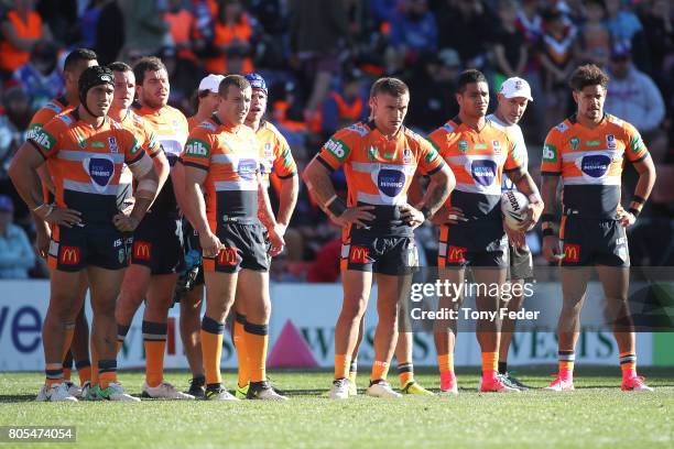 Knights players look dejected during the round 17 NRL match between the Newcastle Knights and the Wests TIgers at McDonald Jones Stadium on July 2,...