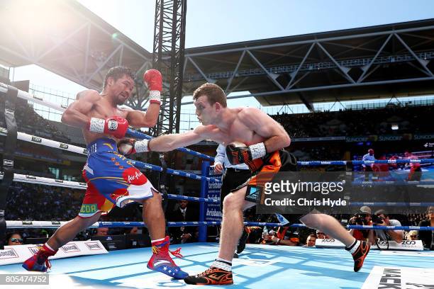 Jeff Horn of Australia punches Manny Pacquiao of the Philippines during the WBO World Welterweight Title Fight at Suncorp Stadium on July 2, 2017 in...