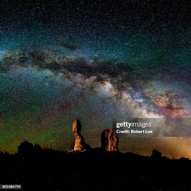 below the galaxy at balanced rock - balanced rock arches national park stock pictures, royalty-free photos & images