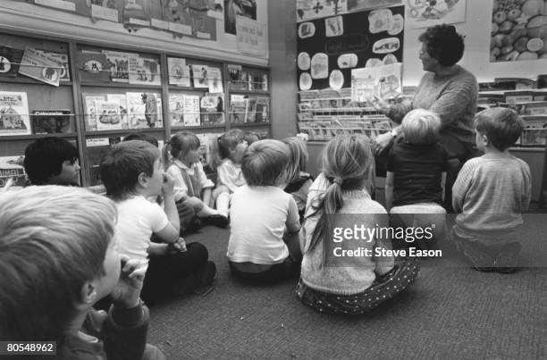 Teacher taking a reading class at Blakeney Primary School in the Forest of Dean, Gloucestershire, April 1988.