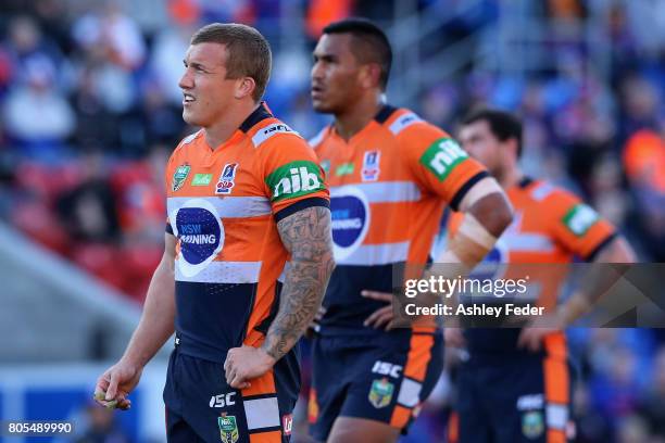 Knights players look on waiting for a decision during the round 17 NRL match between the Newcastle Knights and the Wests TIgers at McDonald Jones...