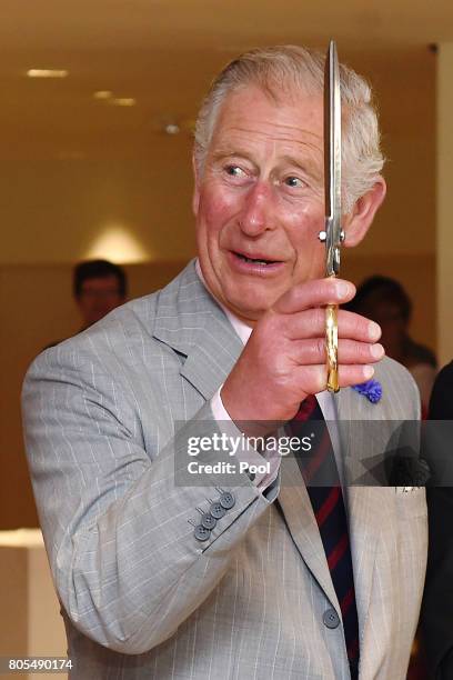 Prince Charles, Prince of Wales cuts a ribbon to offiicially re-open the National Arts Centre during a 3 day official visit to Canada on July 1, 2017...