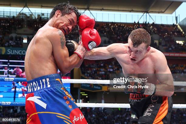 Jeff Horn of Australia punches Manny Pacquiao of the Philippines during the WBO World Welterweight Title Fight at Suncorp Stadium on July 2, 2017 in...