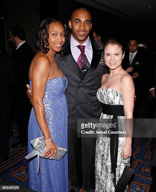 Star David Tyree with wife Leilah Tyree and Jacqueline J. Gonzalez, Executive Director of the New York Emmy's poses for a picture during the cocktail...