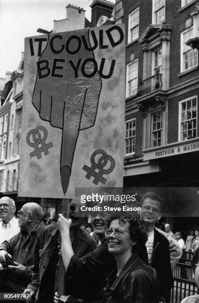 Demonstrators on the annual Gay Pride march, promoting gay and lesbian rights, London, 24th June 1995.