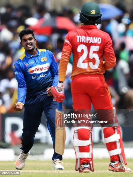 Sri Lanka's Wanidu Hasaranga celebrates after he dismissed Zimbabwe's Donald Tiripano during the second one-day international cricket match between...