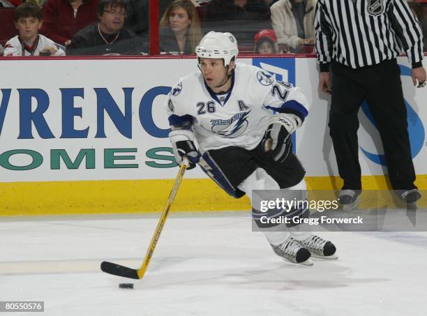 Martin StLouis of the Tampa Bay Lightning carries the puck during their NHL game against the Carolina Hurricanes on April 2, 2008 at RBC Center in...