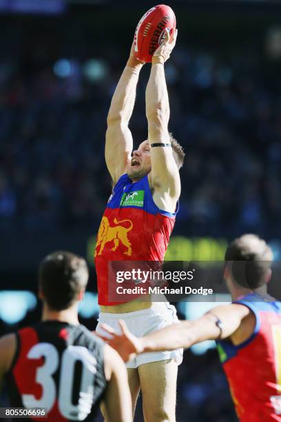 Stefan Martin of the Lions marks the ball during the round 15 AFL match between the Essendon Bombers and the Brisbane Lions at Etihad Stadium on July...