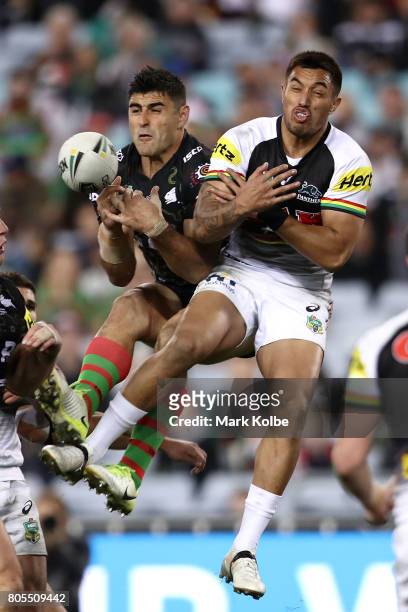 Bryson Goodwin of the Rabbitohs and Waqa Blake of the Panthers compete for the ball froma kick during the round 17 NRL match between the South Sydney...