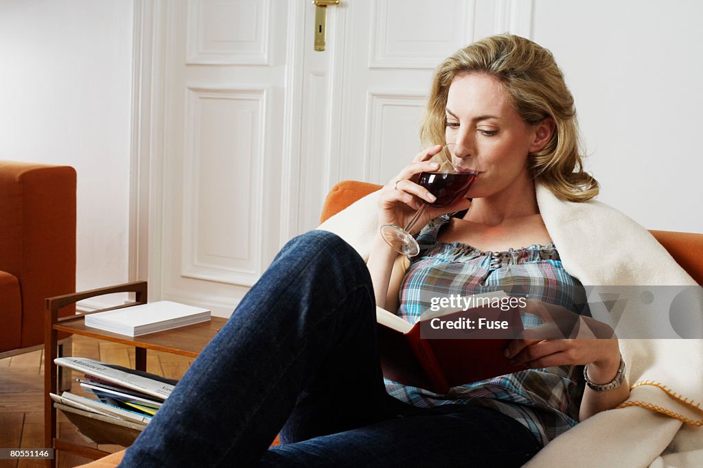 Woman Drinking Wine and Reading