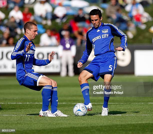 Kerry Zavagnin and Kurt Morsink of the Kansas City Wizards control the ball during the game against the Colorado Rapids at Community America Ballpark...