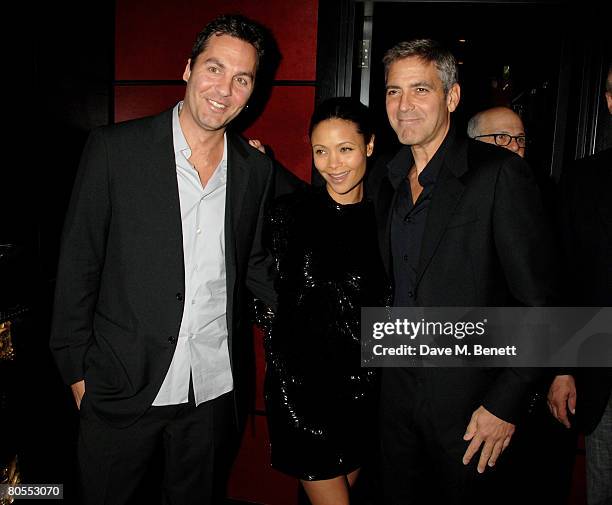 Ol Parker, Thandie Newton and George Clooney attend the Harpers Bazaar dinner for George Clooney hosted by editor Lucy Yeomans, at L'Atelier de Joel...