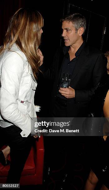 George Clooney and Elle Macpherson attend the Harpers Bazaar dinner for George Clooney hosted by editor Lucy Yeomans, at L'Atelier de Joel Robuchon...