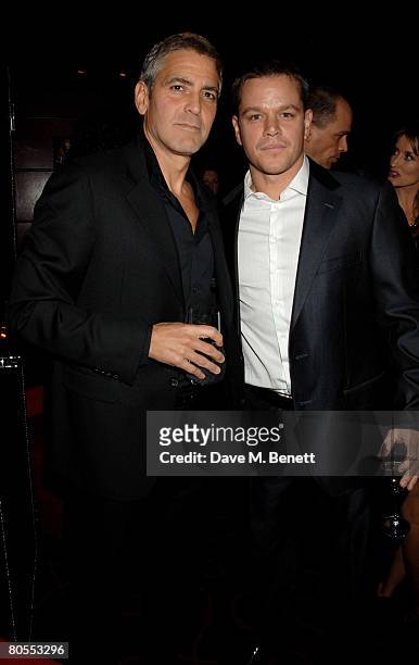 George Clooney and Matt Damon attend the Harpers Bazaar dinner for George Clooney hosted by editor Lucy Yeomans, at L'Atelier de Joel Robuchon on...