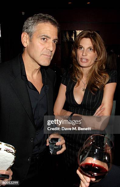 George Clooney and Jemima Khan attend the Harpers Bazaar dinner for George Clooney hosted by editor Lucy Yeomans, at L'Atelier de Joel Robuchon on...