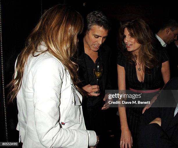 Elle Macpherson, George Clooney and Jemima Khan attend the Harpers Bazaar dinner for George Clooney hosted by editor Lucy Yeomans, at L'Atelier de...