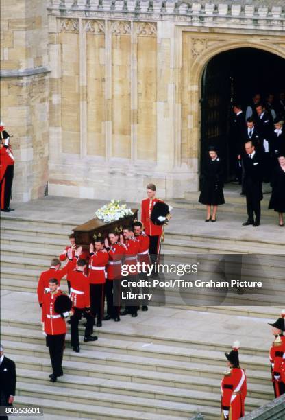 Queen Elizabeth II, Prince Philip, Prince Charles and Princess Diana attend the funeral of the Duchess of Windsor, widow of Duke of Windsor, formerly...