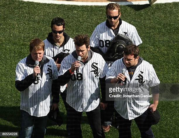 The group "Emerson Drive" performs the National Anthem before the Opening Day game between the Chicago White Sox and the Minnesota Twins during the...