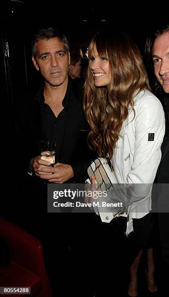 George Clooney and Elle Macpherson attend the Harpers Bazaar dinner for George Clooney hosted by editor Lucy Yeomans, at L'Atelier de Joel Robuchon...