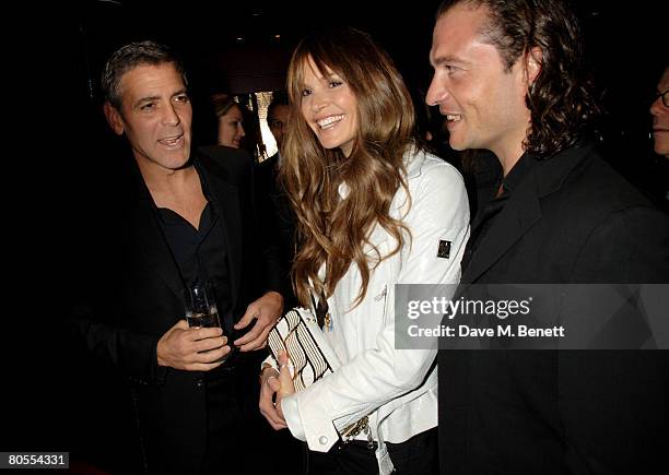 George Clooney and Elle Macpherson attend the Harpers Bazaar dinner for George Clooney hosted by editor Lucy Yeomans, at L'Atelier de Joel Robuchon...