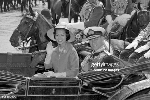 Queen Sirikit of Thailand with the Duke of Edinburgh in an open carriage as they left Victoria Station, London, on a processional drive to Buckingham...