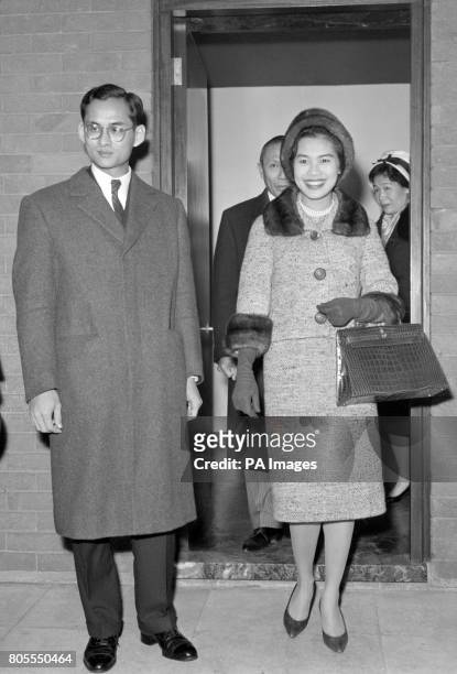 King Bhumibol Adulyadej of Thailand and his consort, Queen Sirikit, arrive at London Airport from Switzerland.