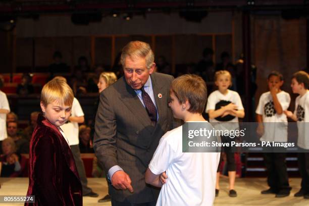 The Prince of Wales meets children from Shottery Primary School after they performed their adaptation of the play Twelfth Night, during a visit to...