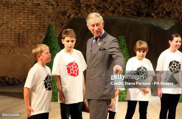 The Prince of Wales meets children from Shottery Primary School after they performed their adaptation of the play Twelfth Night, during a visit to...
