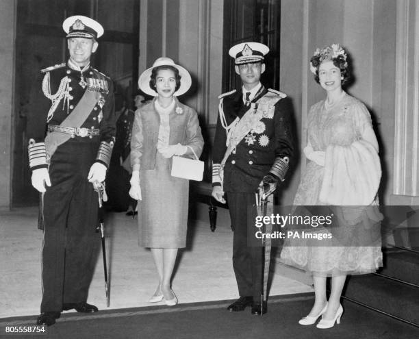 King Bhumibol Adulyadej and Queen Sirikit of Thailand with Queen Elizabeth II and the Duke of Edinburgh at Buckingham Palace after their processional...