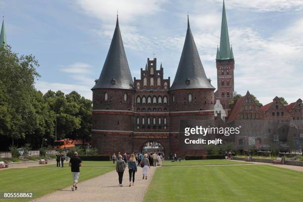 holstentor - the holstein gate, lübeck germany - pejft stock pictures, royalty-free photos & images