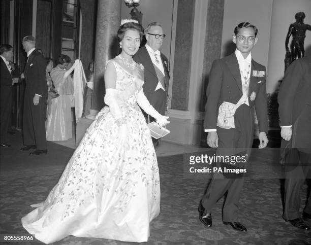King Bhumibol Aduladej and Queen Sirikit of Thailand arriving at Lancaster House, London, for a dinner and reception given in their honour by Selwyn...