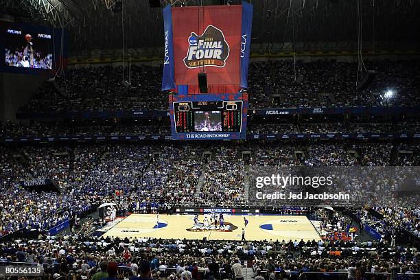 Robert Dozier of the Memphis Tigers and Darrell Arthur of the Kansas Jayhawks both jump for the tip-off to start the first half during the 2008 NCAA...