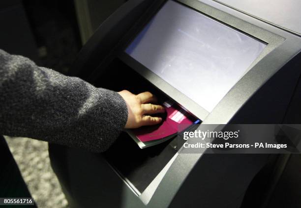 Home Secretary Alan Johnson tests the new fast track facial recognition gates in the North Terminal of Gatwick airport, Sussex.