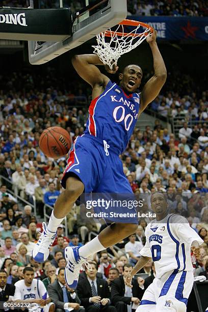 Darrell Arthur of the Kansas Jayhawks reacts after dunking the ball against the Memphis Tigers in the first half during the 2008 NCAA Men's National...