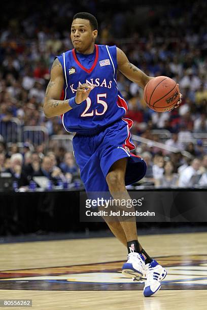 Brandon Rush of the Kansas Jayhawks moves the ball while taking on the North Carolina Tar Heels during the National Semifinal game of the NCAA Men's...