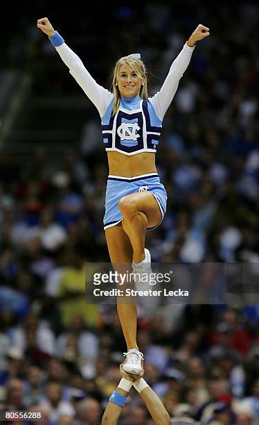 North Carolina Tar Heels cheerleader performs while their team is taking on the Kansas Jayhawks during the National Semifinal game of the NCAA Men's...