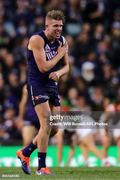 Luke Ryan of the Dockers clutches his left shoulder during the round 15 AFL match between the Fremantle Dockers and the St Kilda Saints at Domain...