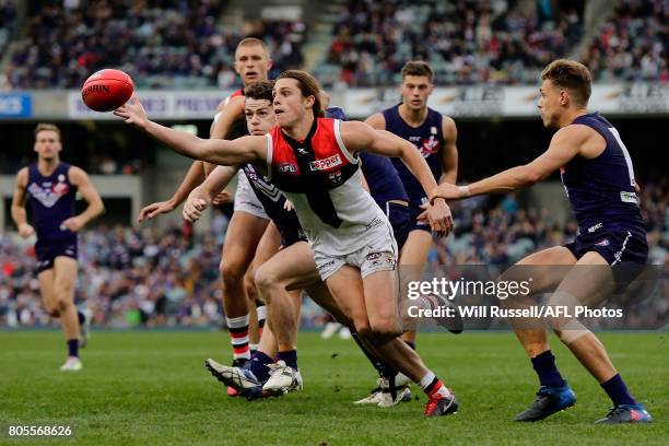 Jack Steele of the Saints juggles the ball during the round 15 AFL match between the Fremantle Dockers and the St Kilda Saints at Domain Stadium on...