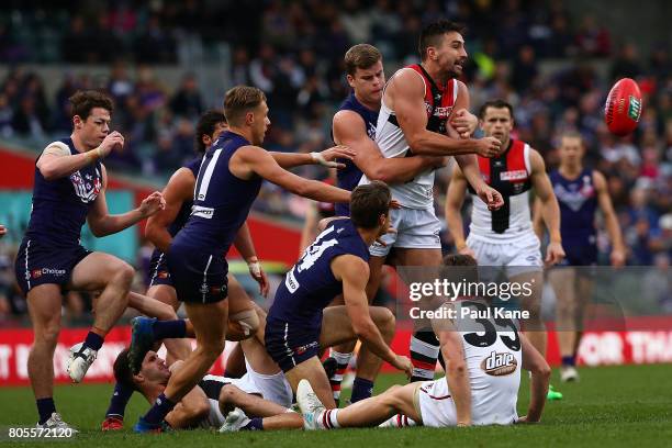 Billy Longer of the Saints handballs during the round 15 AFL match between the Fremantle Dockers and the St Kilda Saints at Domain Stadium on July 2,...