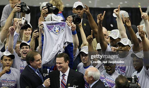 Head coach Bill Self of the Kansas Jayhawks is interviewed by Jim Nantz of CBS after defeating the Memphis Tigers 75-68 in overtime during the 2008...