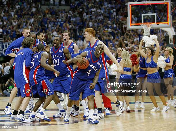 Sherron Collins and the Kansas Jayhawks celebrate after defeating the Memphis Tigers 75-68 in overtime during the 2008 NCAA Men's National...