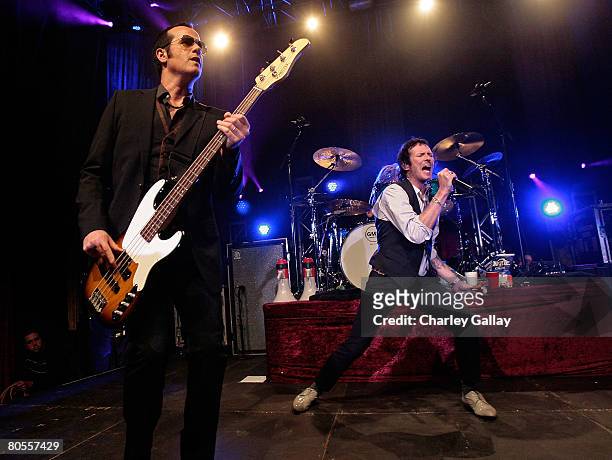 Musician Robert DeLeo and frontman Scott Weiland perform onstage during the Stone Temple Pilots tour announcement and performance held at a private...